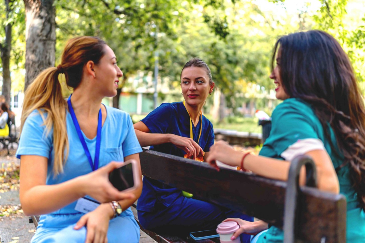 Nursing students sitting in park.