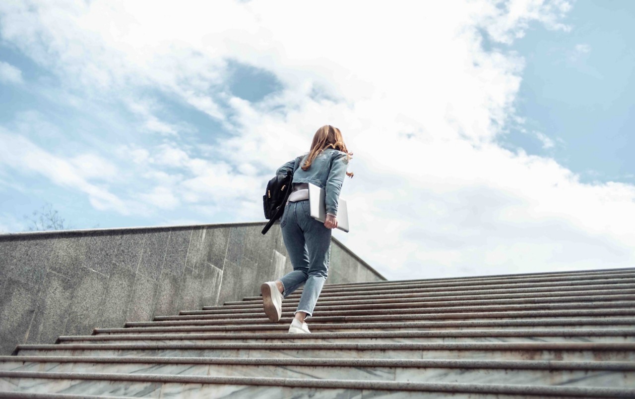 Student walking up steps.