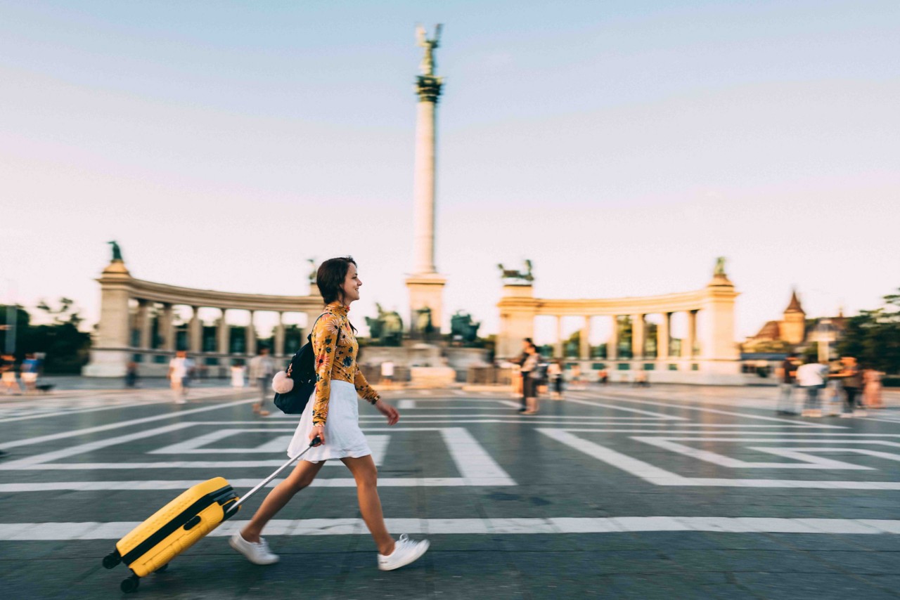 Student walking abroad with luggage